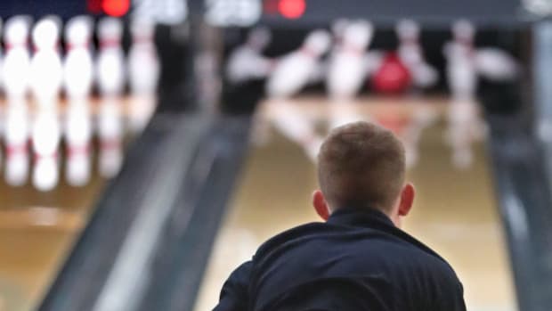 Ellet's Austin Dennis watches his ball as he rolls a strike during the Division I bowling sectional at Stonehedge Bowling Center in Akron. Austin Dennis Ellet Bowler Feat 2